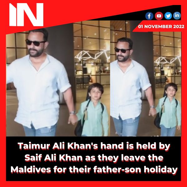 Taimur Ali Khan’s hand is held by Saif Ali Khan as they leave the Maldives for their father-son holiday.
