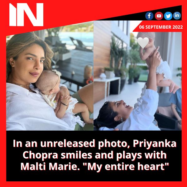 In an unreleased photo, Priyanka Chopra smiles and plays with Malti Marie. “My entire heart”
