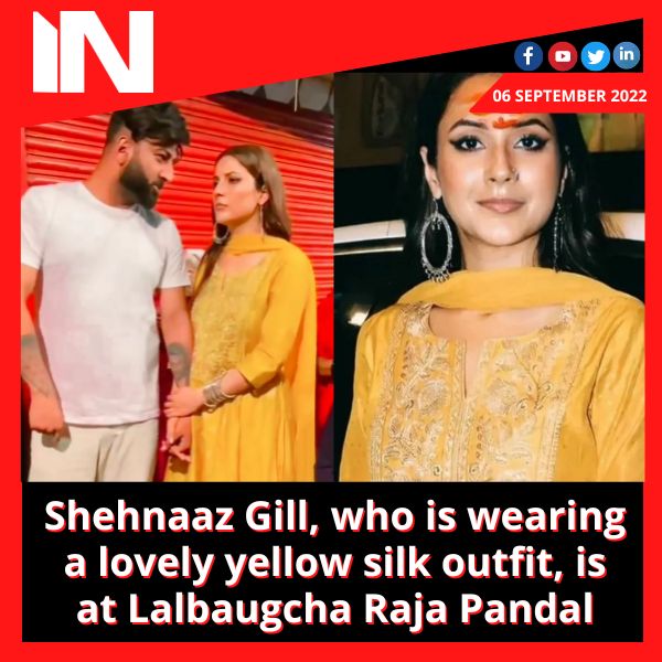 Shehnaaz Gill, who is wearing a lovely yellow silk outfit, is at Lalbaugcha Raja Pandal