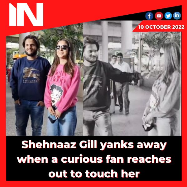 Shehnaaz Gill yanks away when a curious fan reaches out to touch her.