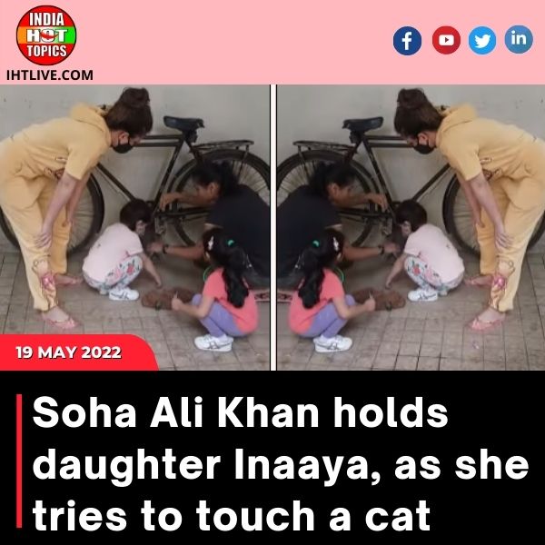 Soha Ali Khan holds daughter Inaaya, as she tries to touch a cat