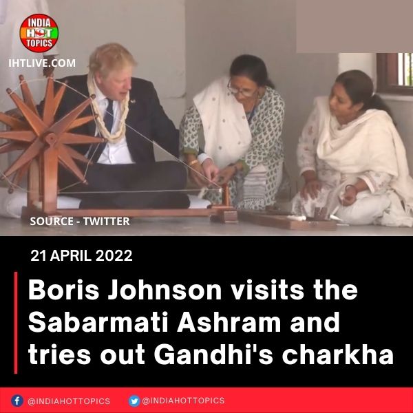 Boris Johnson visits the Sabarmati Ashram and tries out Gandhi’s charkha