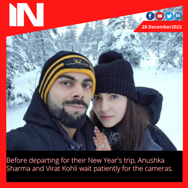 Before departing for their New Year’s trip, Anushka Sharma and Virat Kohli wait patiently for the cameras.