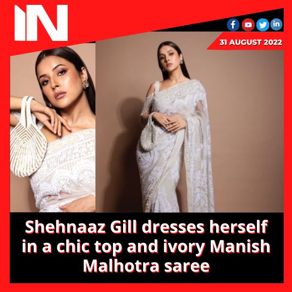 Shehnaaz Gill dresses herself in a chic top and ivory Manish Malhotra saree