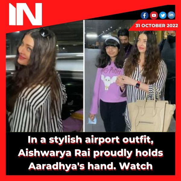 In a stylish airport outfit, Aishwarya Rai proudly holds Aaradhya’s hand.